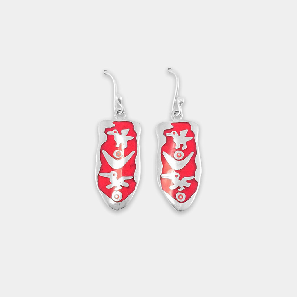 aretes pelícano con canoa